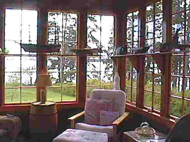 This is the sunroom with its beautiful fireplace, old ship models and 